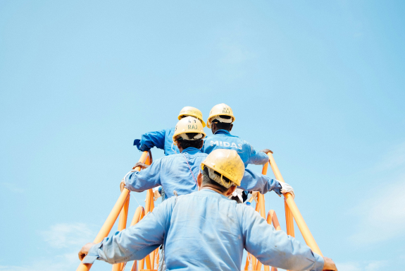 Multiple workers external staircase yellow and blue 1