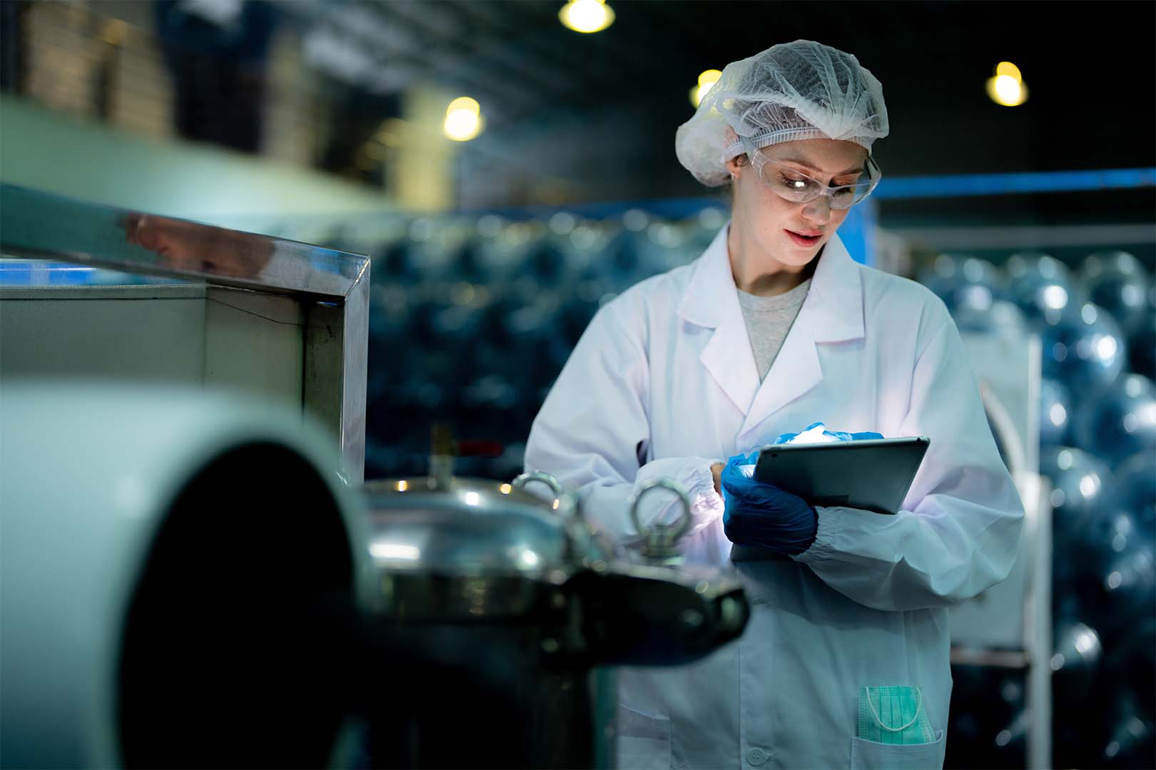 lab technician checking tablet