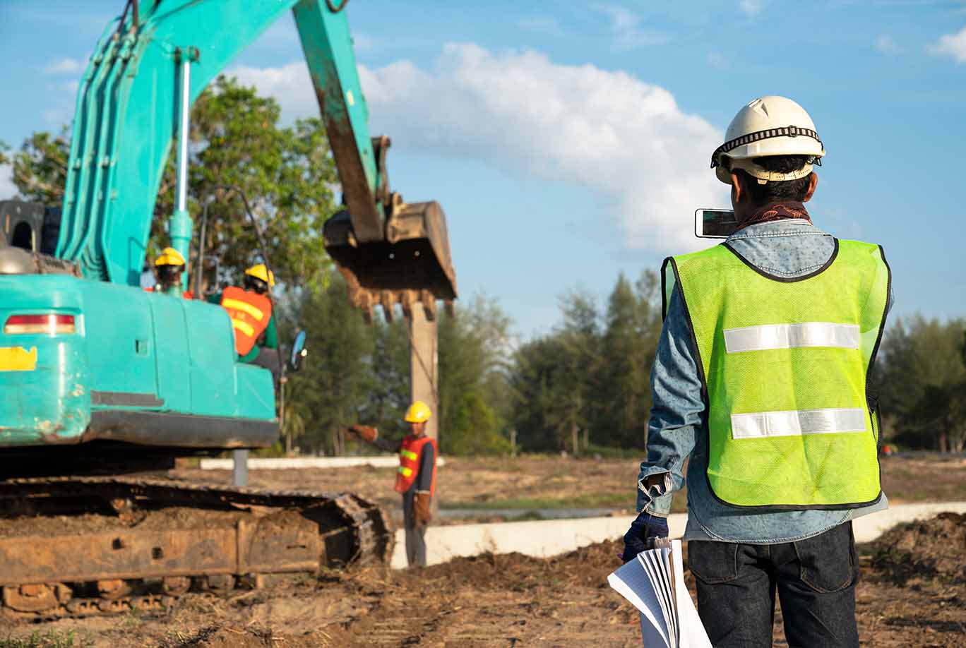 person at construction site observing risk